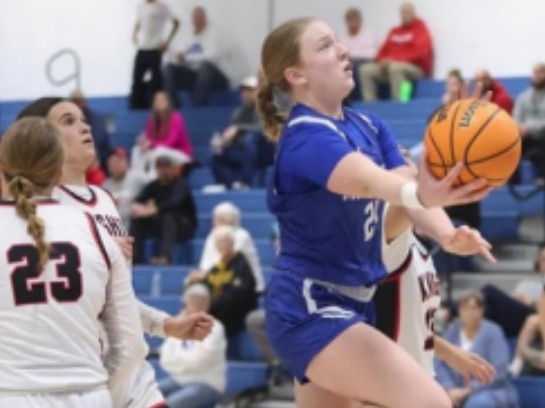 Allie scoring a basket.