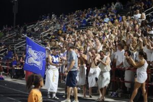 Captain Marquette (Eli Baggio) shaking Principal Tim Harmon's hand at the September 4th Football Game. Photo courtesy of Emma Hough.